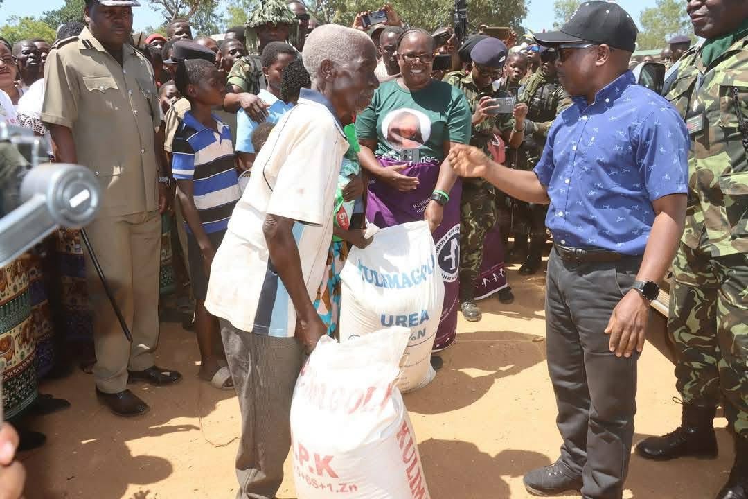 Veep giving fertilizer to the elderly